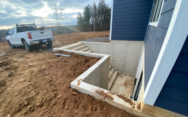 concrete outdoor construction of steps and slab retaining wall