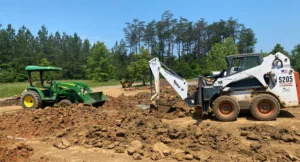 green team builder excavators digging drainage trenches in virginia