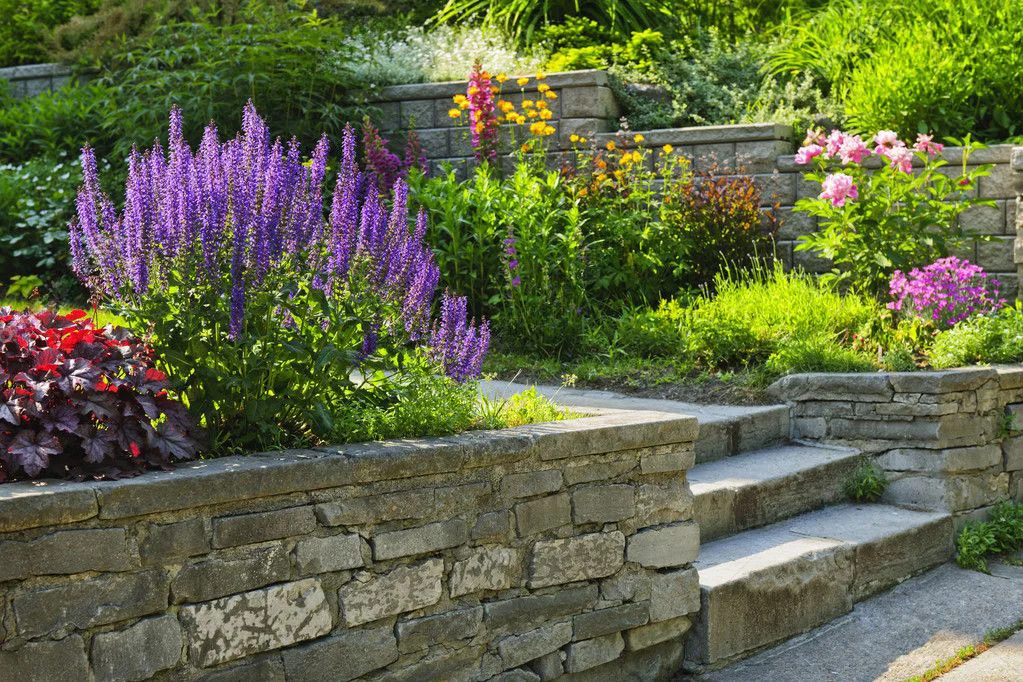 brick retaining wall garden with flowers